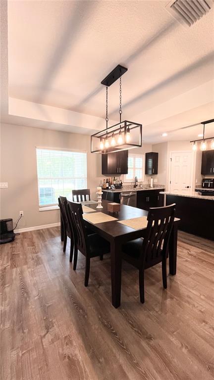 13486 English Sparrow Road Weeki Wachee, FL 34614 - Photo 16 of 51 a view of a dining room with furniture and chandelier