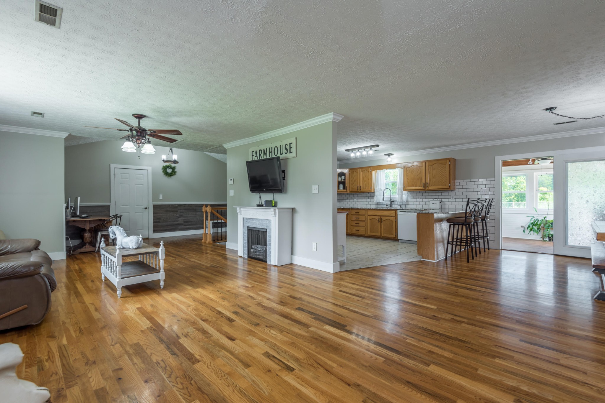 7400 Clapps Chapel Road Corryton, TN 37721 - Photo 8 of 40 a living room with furniture wooden floor and a kitchen