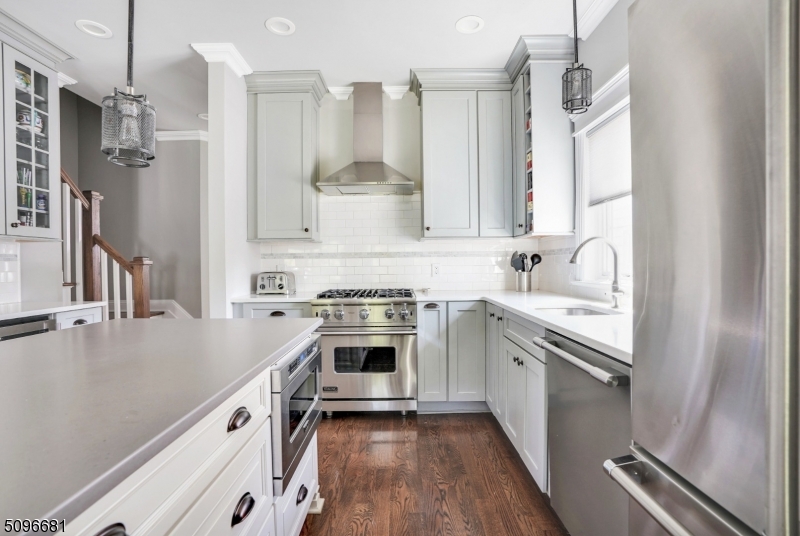 17 Spring Street Millburn, NJ 07041 - Photo 5 of 16 a kitchen with granite countertop a sink stainless steel appliances and cabinets