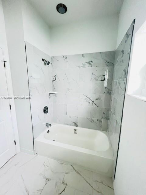 475 Sunset Road North Rotonda West, FL 33947 - Photo 12 of 17 a white bath tub sitting next to a shower