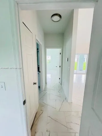 a bathroom with a glass door shower