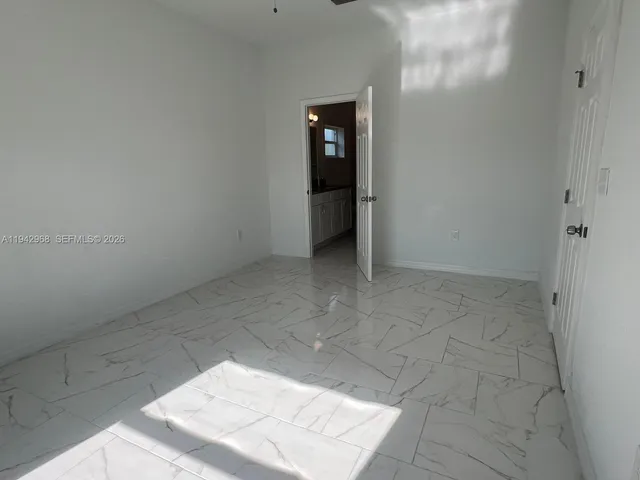 a view of an empty room and window