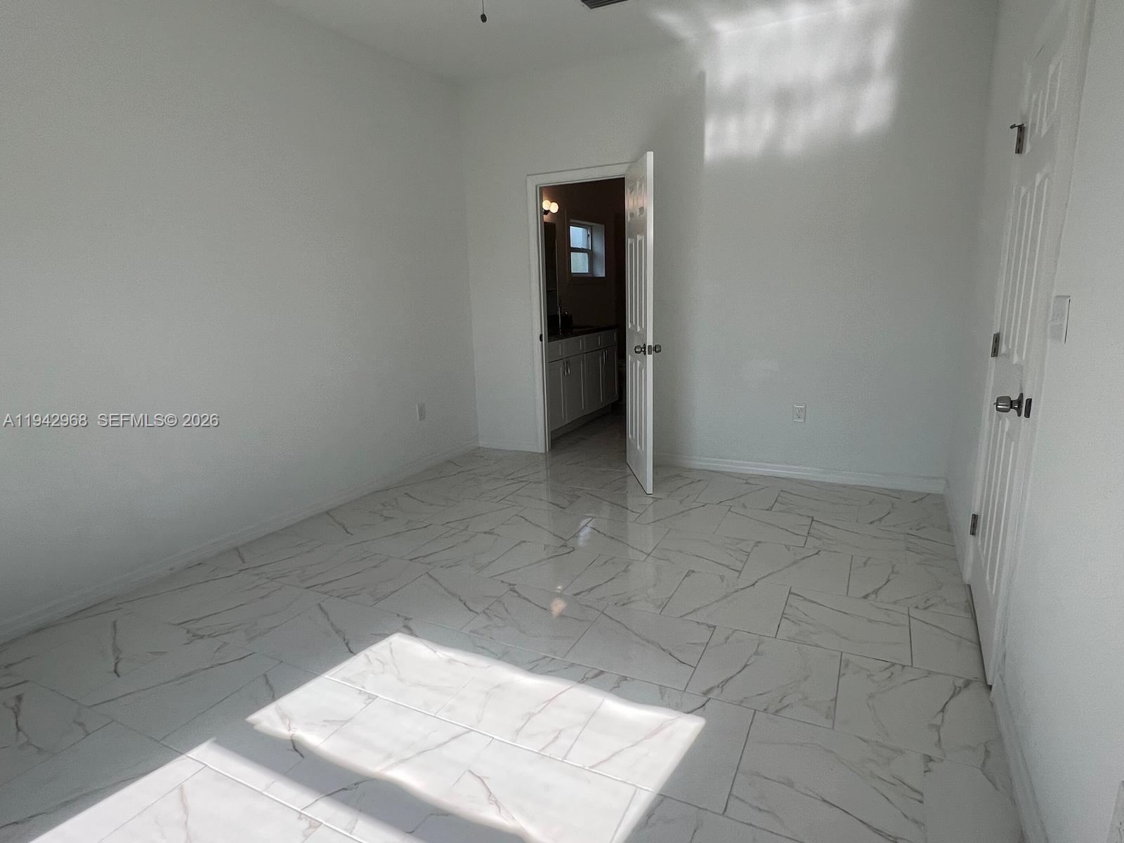 475 Sunset Road North Rotonda West, FL 33947 - Photo 16 of 17 a view of an empty room and window