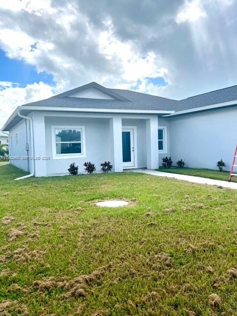 475 Sunset Road North Rotonda West, FL 33947 - Photo 2 of 17 a view of a house with a yard
