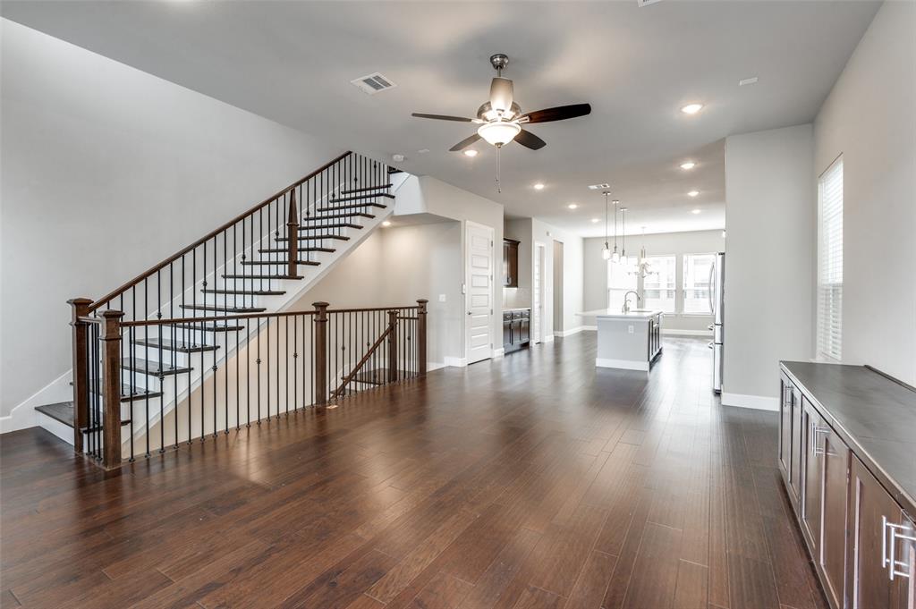 8233 Laflin Lane Dallas, TX 75231 - Photo 11 of 37 a view of a hallway with wooden floor and workspace