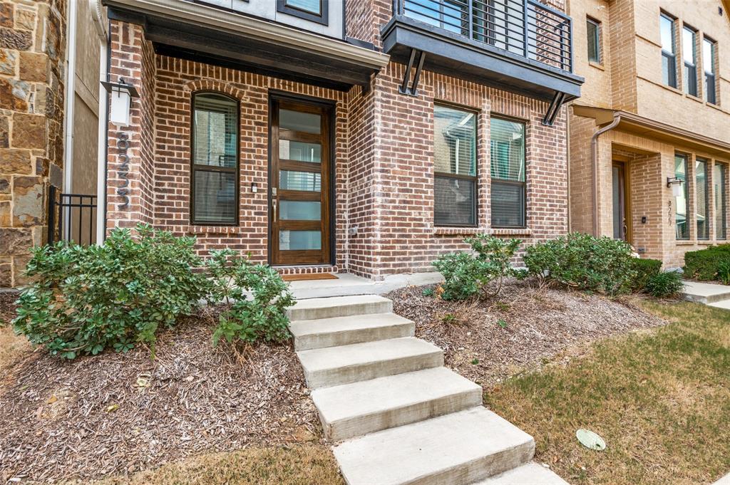 8233 Laflin Lane Dallas, TX 75231 - Photo 2 of 37 a front view of a house with a yard
