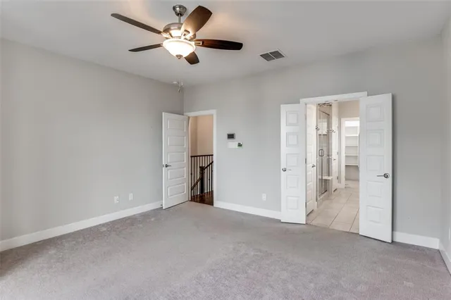a bathroom with a sink double vanity granite tub shower and mirror