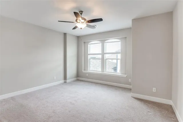 a bathroom with a glass shower door and a sink