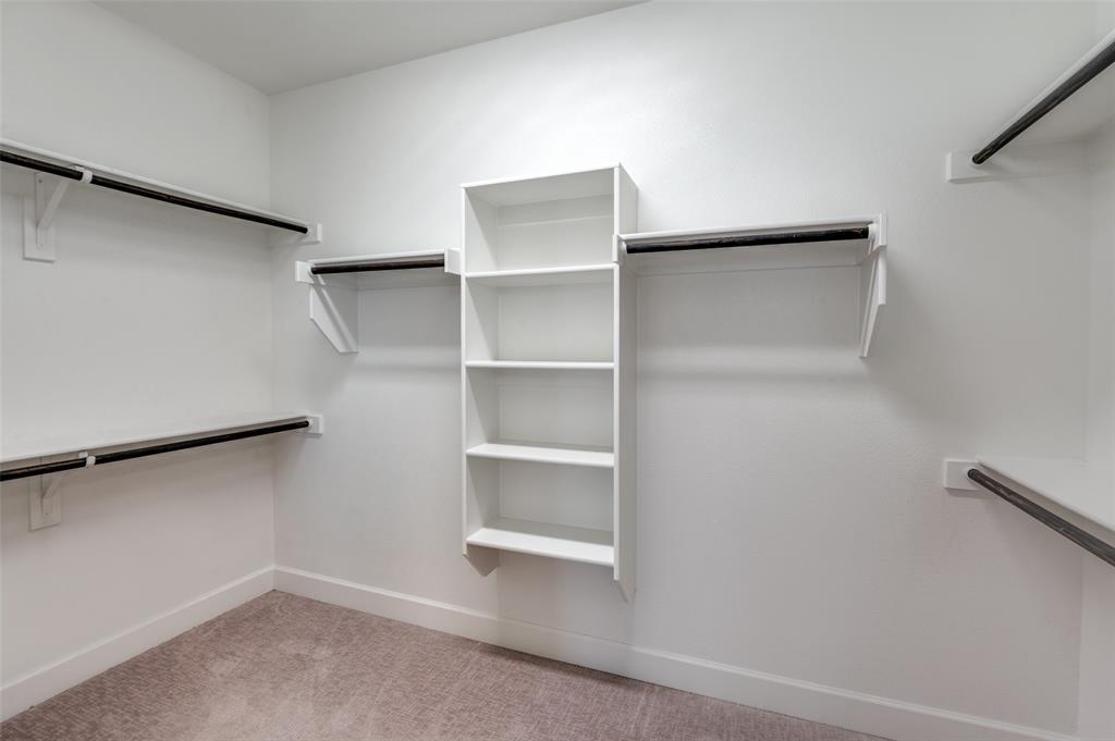 8233 Laflin Lane Dallas, TX 75231 - Photo 26 of 37 a view of an empty walk in closet