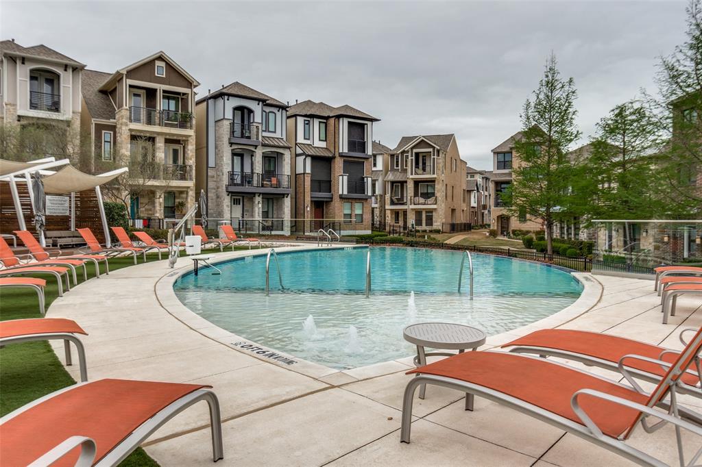 8233 Laflin Lane Dallas, TX 75231 - Photo 32 of 37 a view of a swimming pool with a lounge chairs