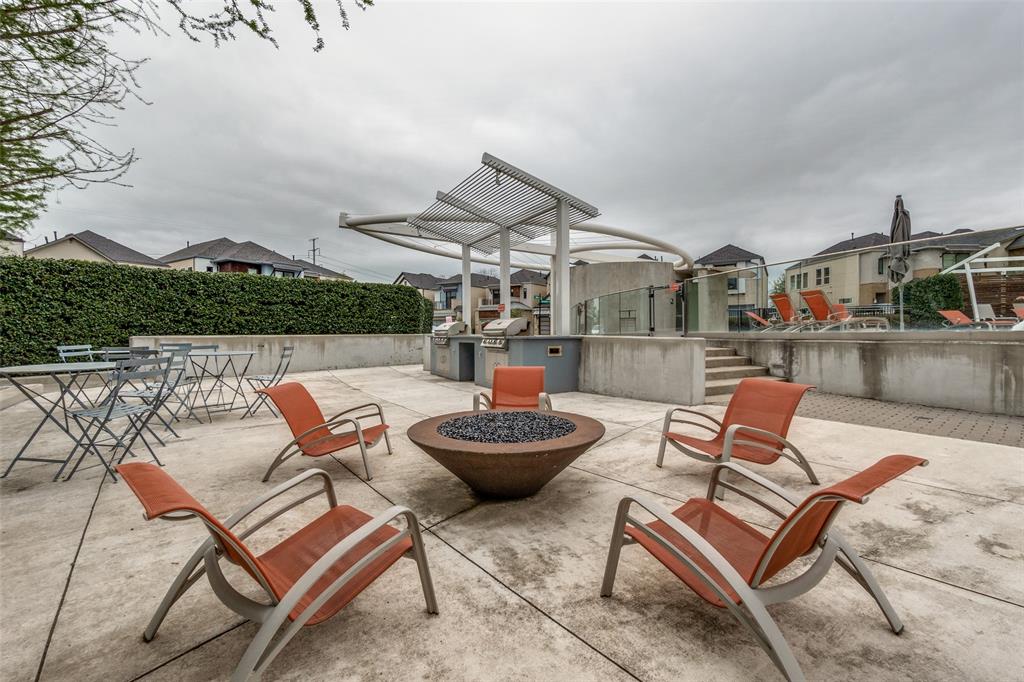 8233 Laflin Lane Dallas, TX 75231 - Photo 33 of 37 a patio with a table and chairs