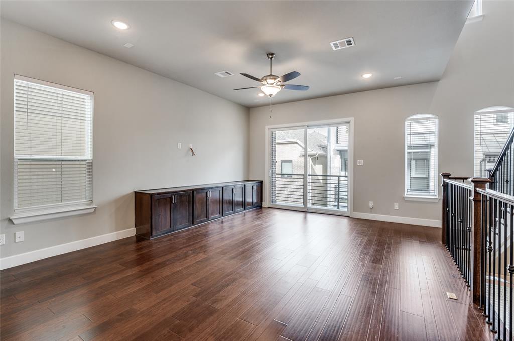 8233 Laflin Lane Dallas, TX 75231 - Photo 10 of 37 a view of an empty room with wooden floor and a window
