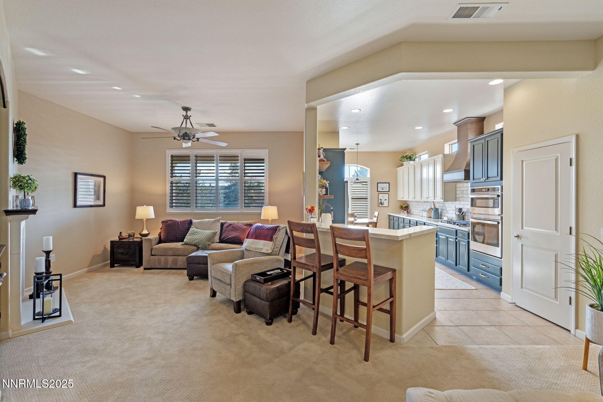 9900 Wilbur May Parkway, Unit 906 Reno, NV 89521 - Photo 15 of 45 a living room with furniture and a large window