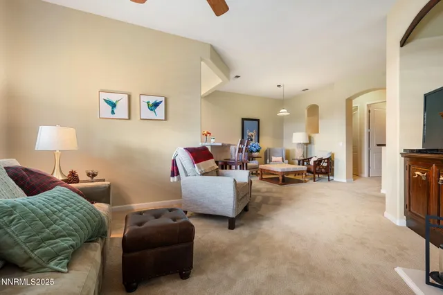 a living room with furniture and a lamp