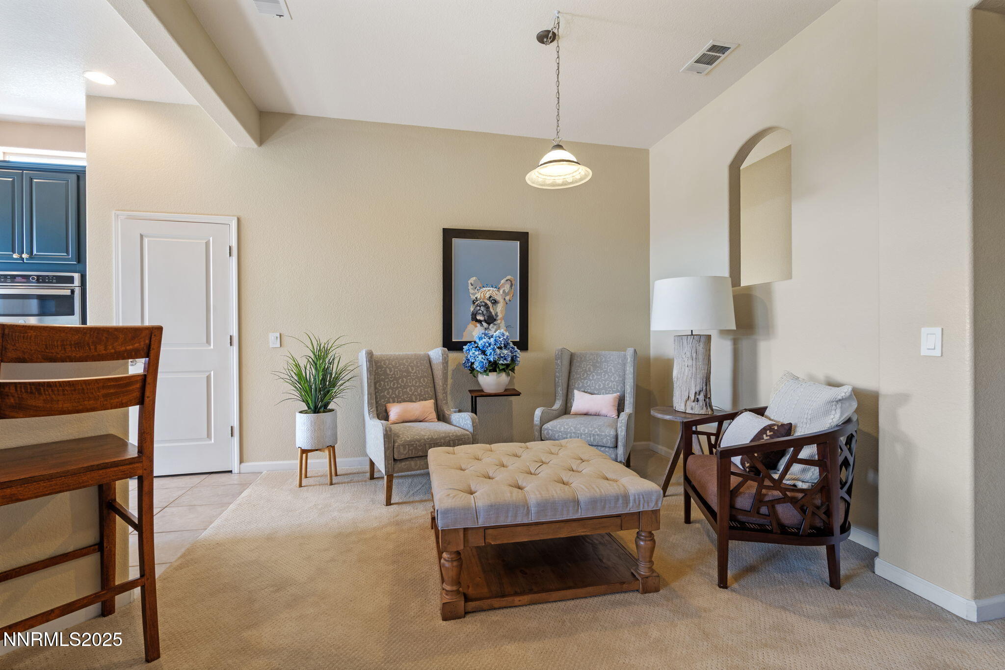 9900 Wilbur May Parkway, Unit 906 Reno, NV 89521 - Photo 19 of 45 a living room with furniture and a lamp