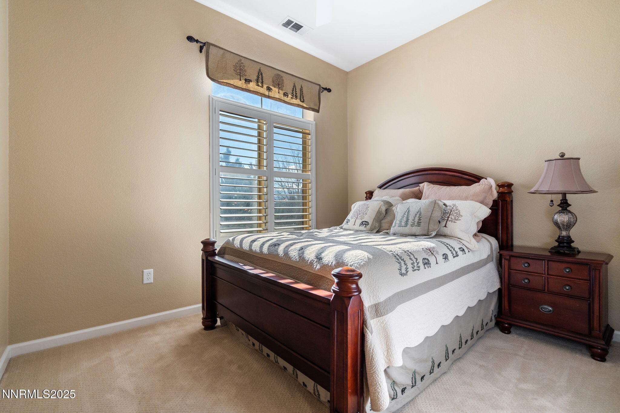 9900 Wilbur May Parkway, Unit 906 Reno, NV 89521 - Photo 29 of 45 a bedroom with a bed and a window