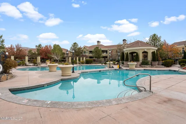 a view of a fountain in front of a house