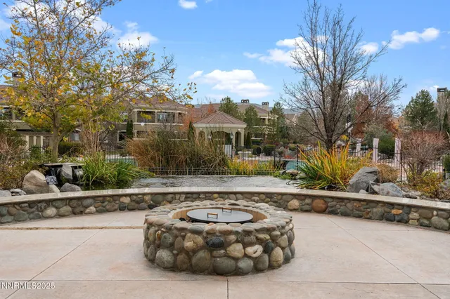 a view of a house with a large tree