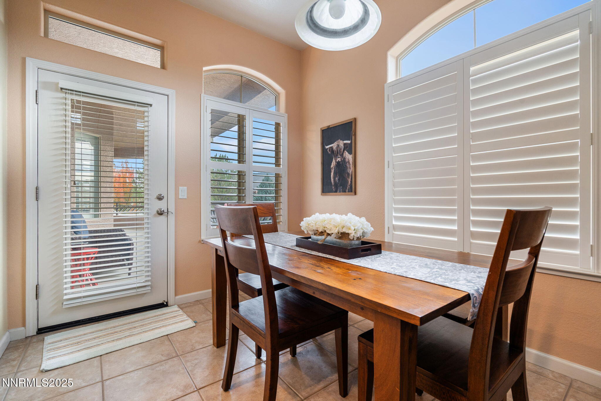 9900 Wilbur May Parkway, Unit 906 Reno, NV 89521 - Photo 10 of 45 a view of a dining room with furniture and window