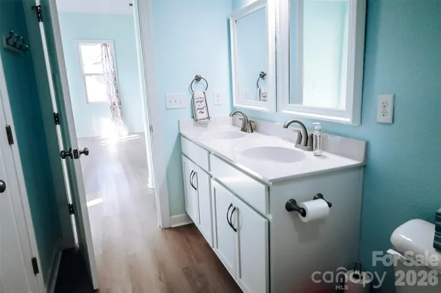 a view of a livingroom and a dining room with furniture