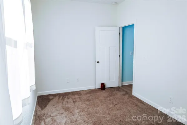 a bathroom with a sink toilet and a mirror