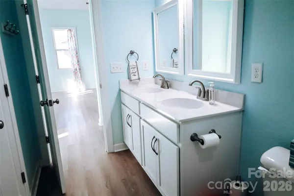 a view of a livingroom and a dining room with furniture