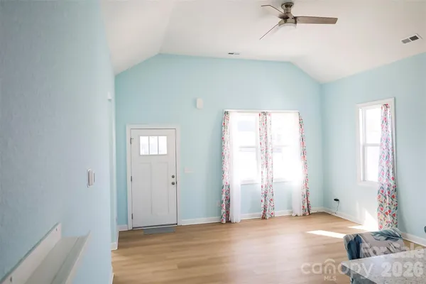 a view of an empty room with a window