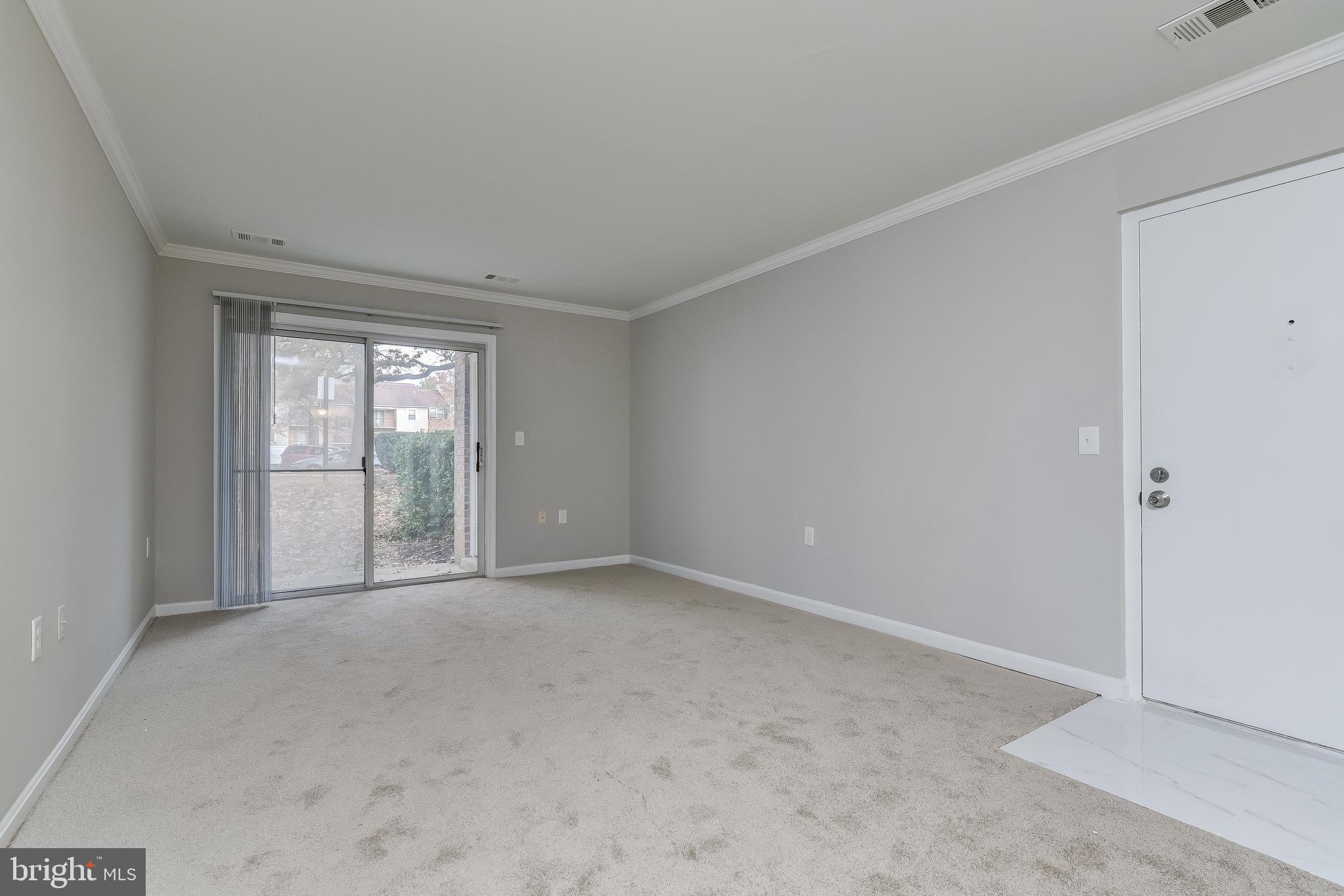 18322 Streamside Drive, Unit 104 Gaithersburg, MD 20879 - Photo 3 of 38 Living & Dining Areas