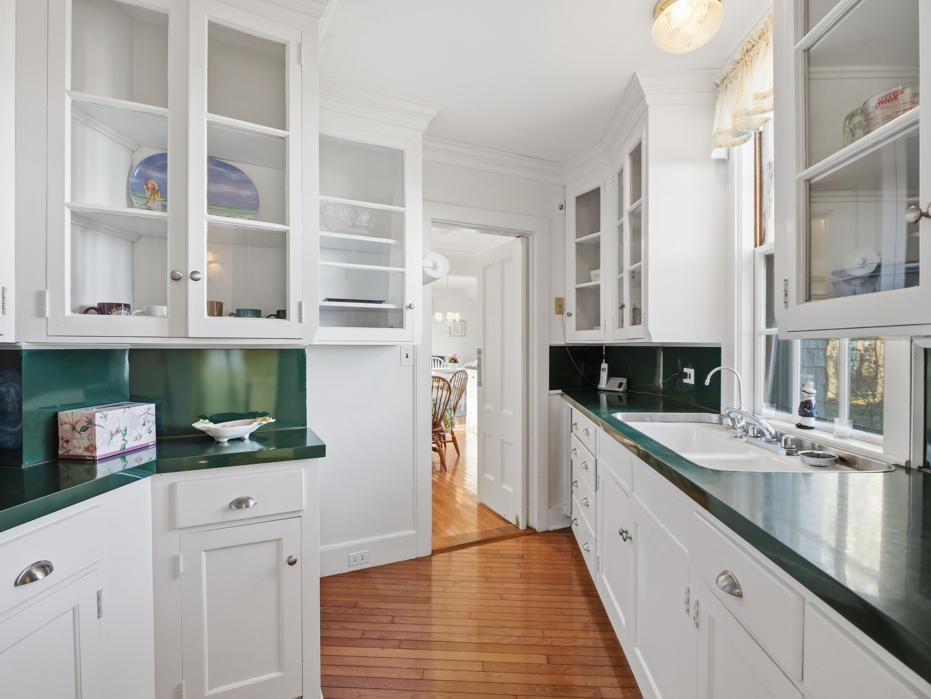 190 Vineyard Road Cotuit, MA 02635 - Photo 16 of 41 a kitchen with stainless steel appliances white cabinets and a counter top space