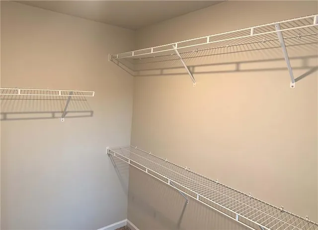 a view of a room with racks on the wall