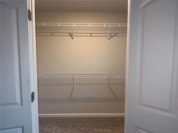 a view of a room with racks on the wall