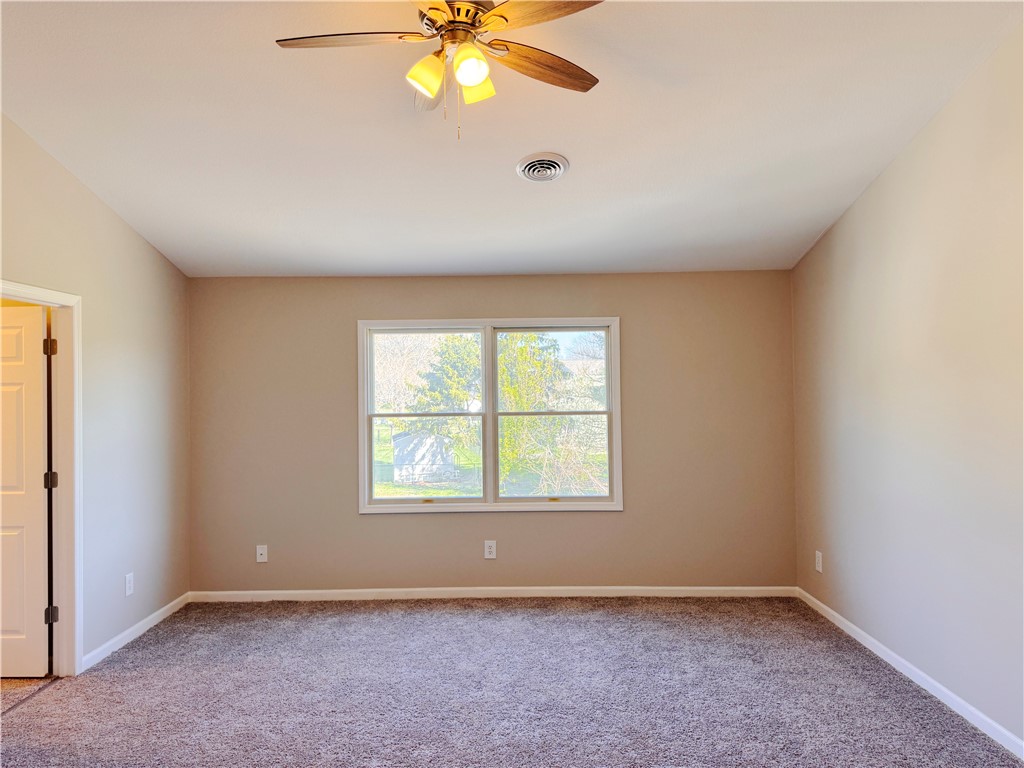 1118 Wedgewood Court Decatur, IL 62526 - Photo 15 of 22 an empty room with windows and chandelier fan