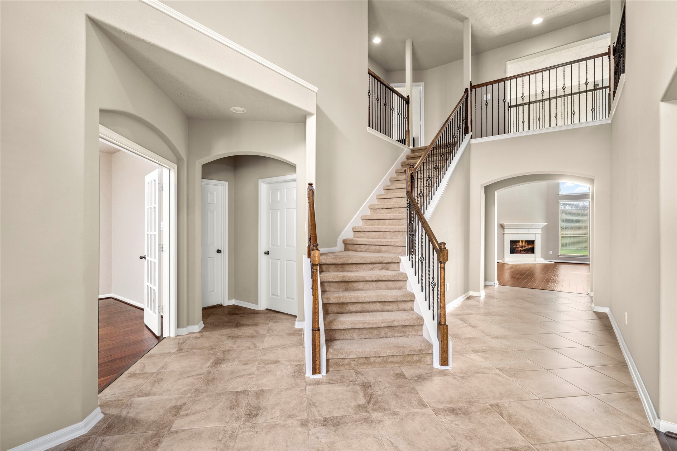 5307 Amber Sky Lane Rosharon, TX 77583 - Photo 6 of 50 From the moment you enter, the home unfolds beautifully — a refined home office to the left and an inviting living room straight ahead, all connected by an effortless, open-concept flow.