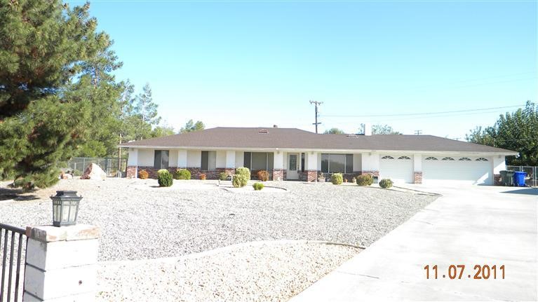 14281 Tehachapi Road Apple Valley, CA 92307 - Photo 1 of 1 a house with a outdoor space
