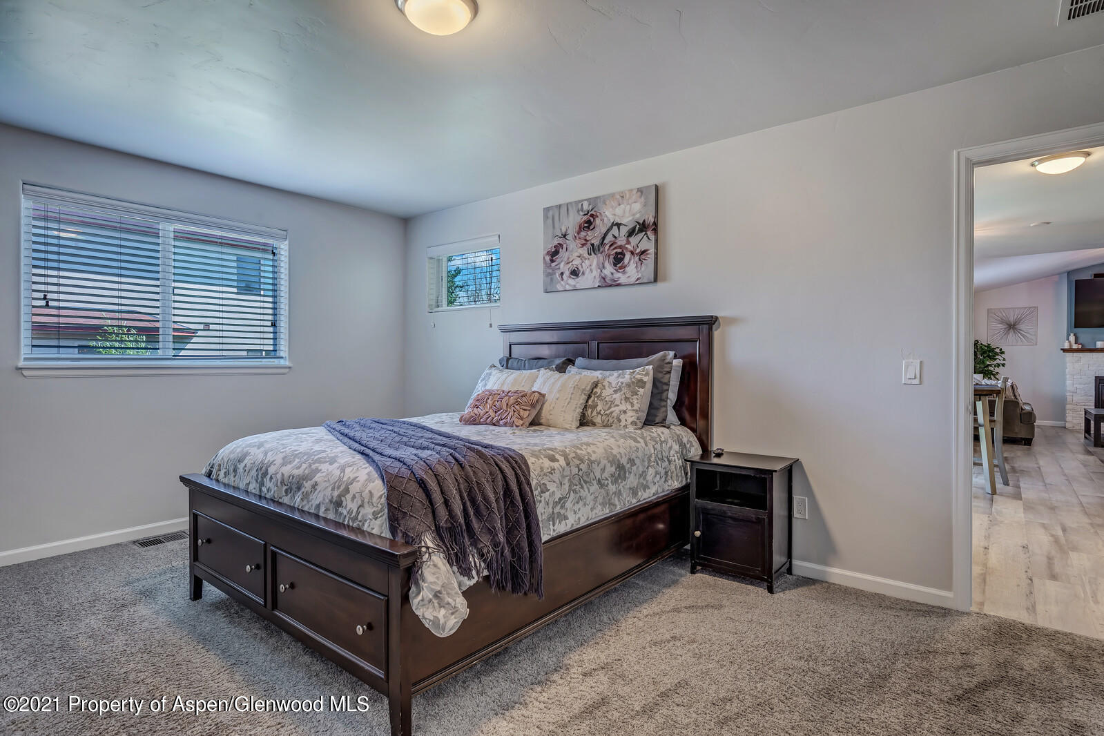 932 East 17th Street Rifle, CO 81650 - Photo 13 of 21 a spacious bedroom with a bed and window