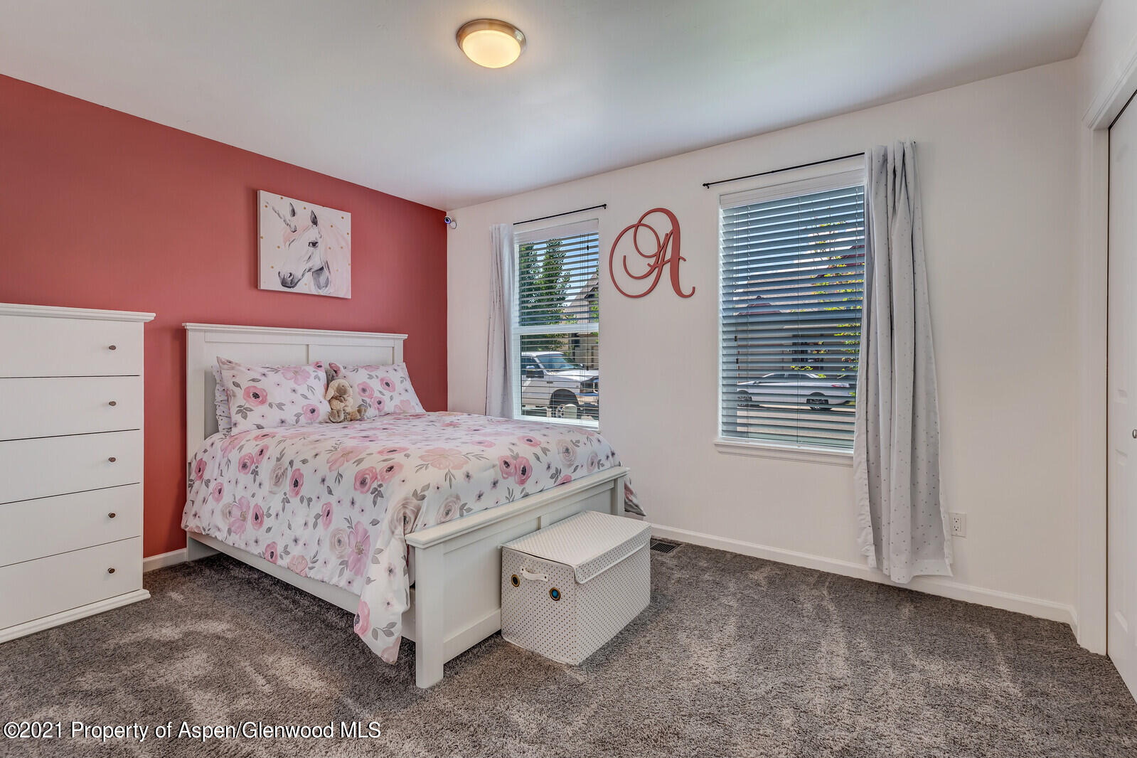 932 East 17th Street Rifle, CO 81650 - Photo 18 of 21 a bedroom with a bed and a window