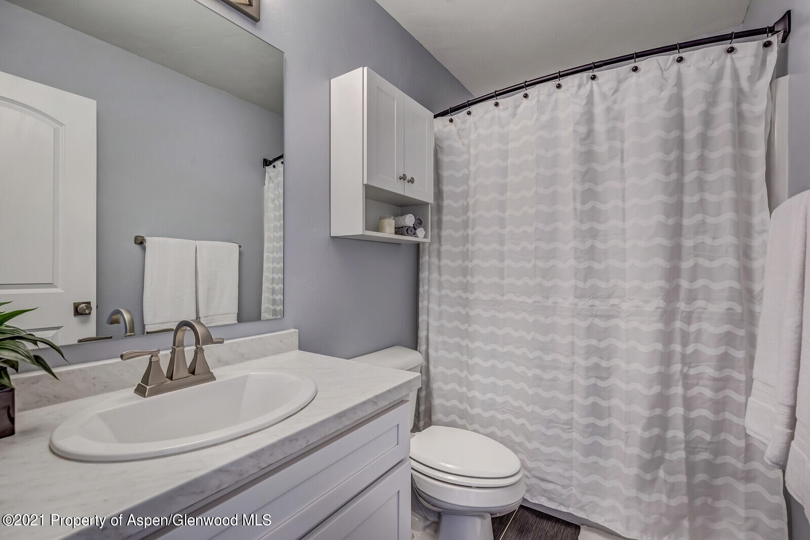 932 East 17th Street Rifle, CO 81650 - Photo 19 of 21 a bathroom with a sink and a mirror