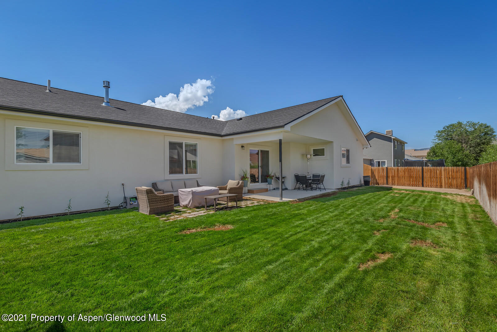 932 East 17th Street Rifle, CO 81650 - Photo 3 of 21 a front view of a house with backyard and sitting area