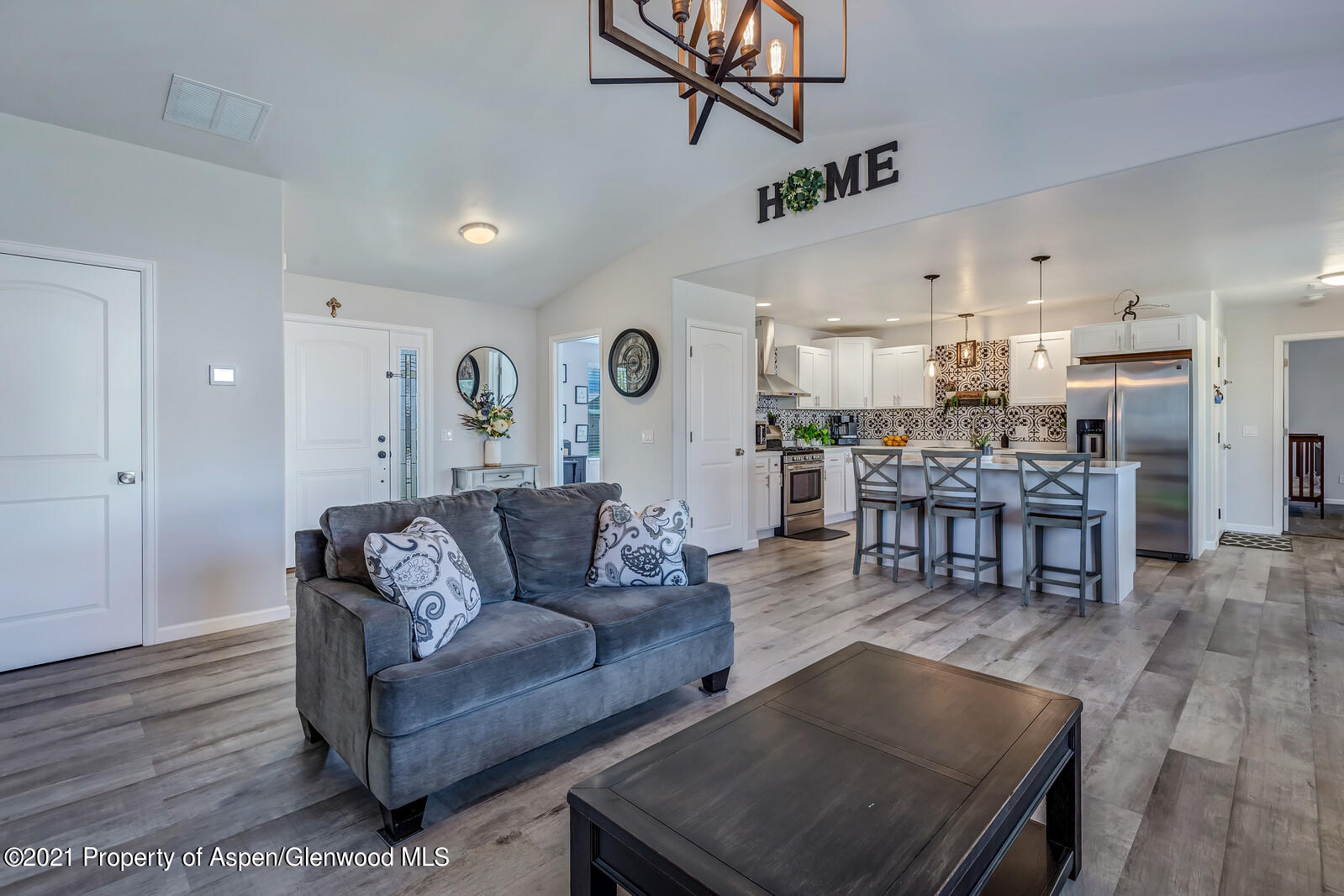 932 East 17th Street Rifle, CO 81650 - Photo 6 of 21 a living room with furniture and kitchen view