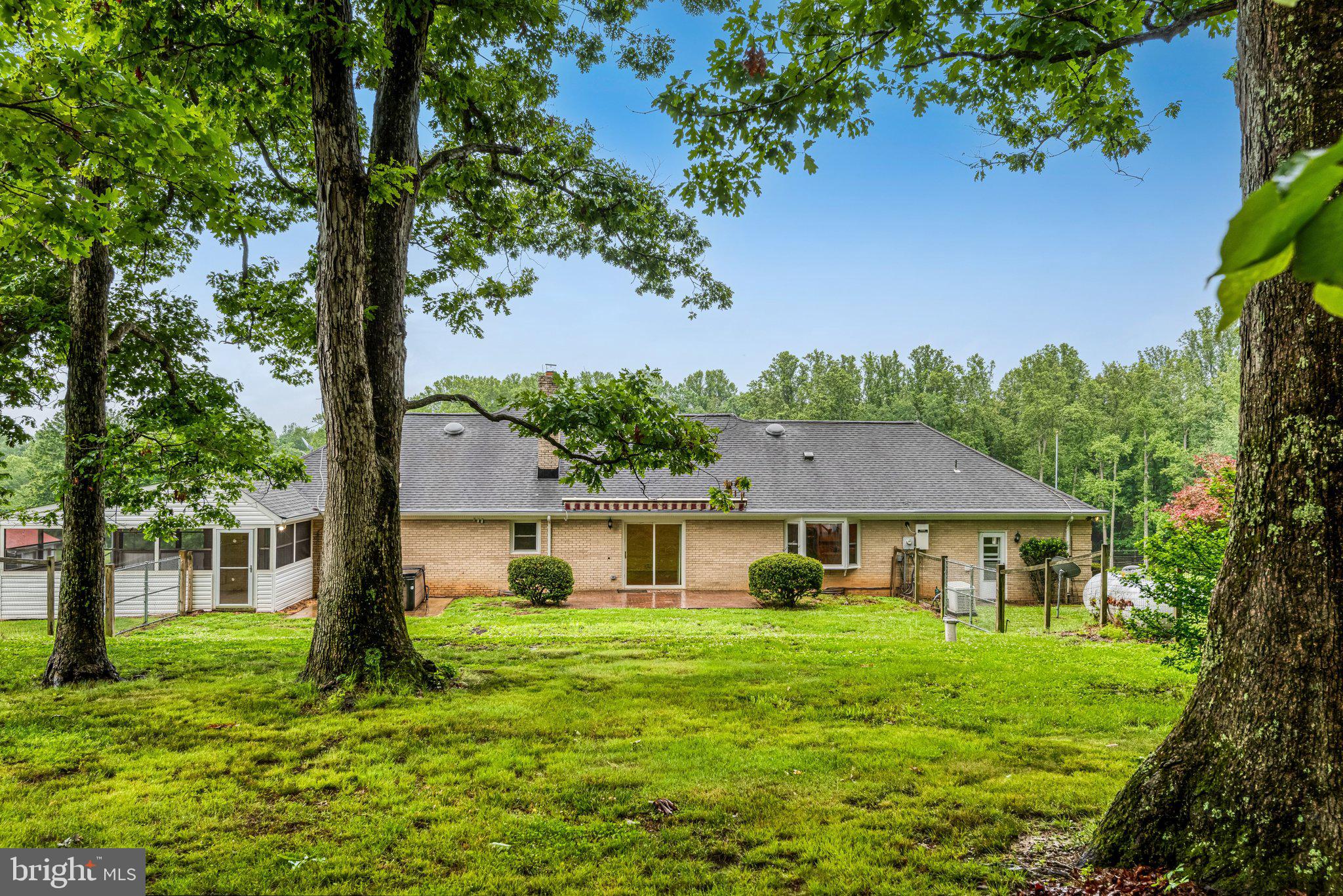 7961 Leeds Manor Road Marshall, VA 20115 - Photo 30 of 40 a front view of a house with a yard