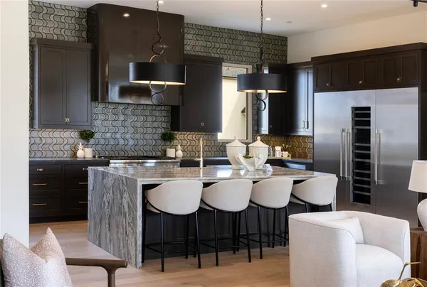 a kitchen with a sink cabinets and stainless steel appliances