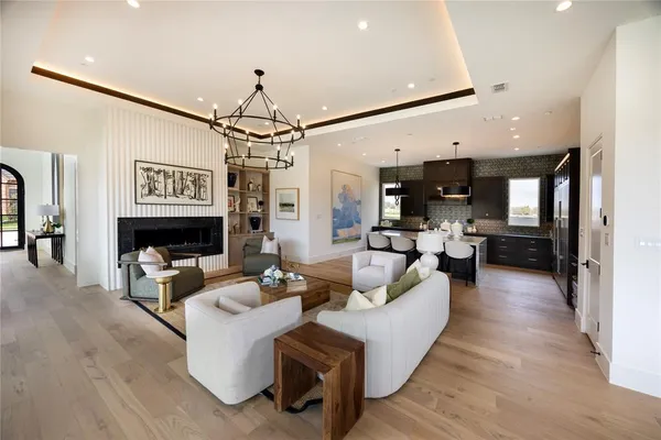 a living room with fireplace furniture and a flat screen tv
