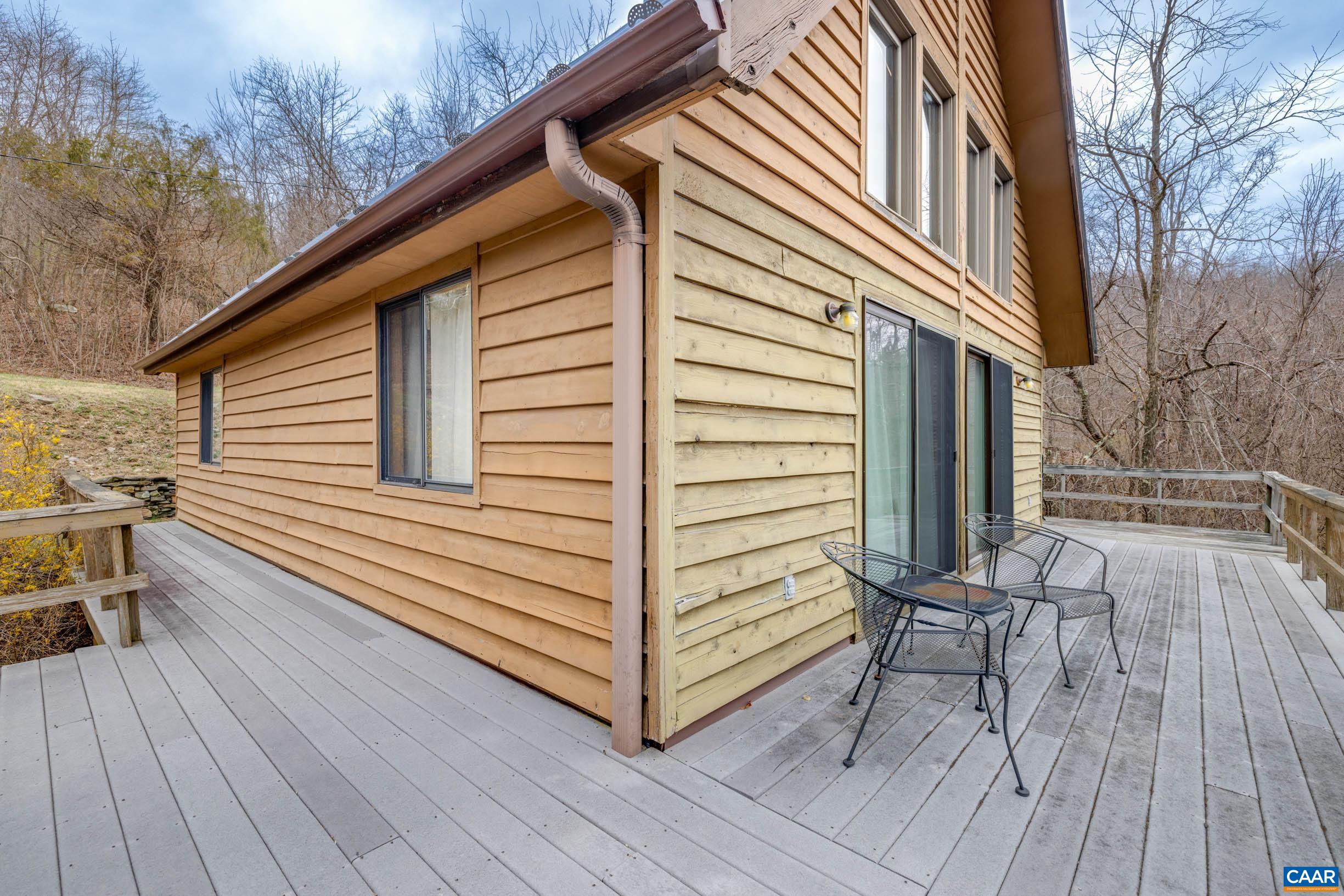 3728 Flattop Mountain Road Free Union, VA 22940 - Photo 13 of 17 a view of a wooden chairs on the deck