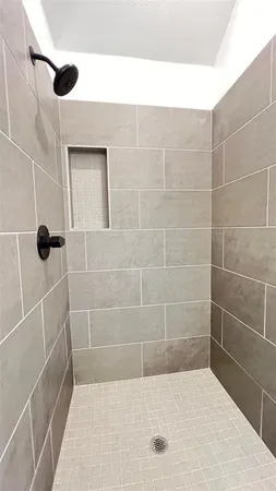 a view of a room with storage and racks on wall