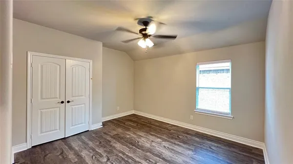 a bathroom with a granite countertop sink and a bathtub