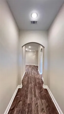 a view of kitchen with wooden floor and window