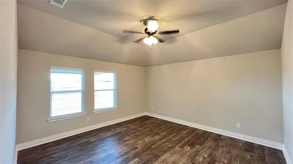 a bathroom with a tub sink toilet and view