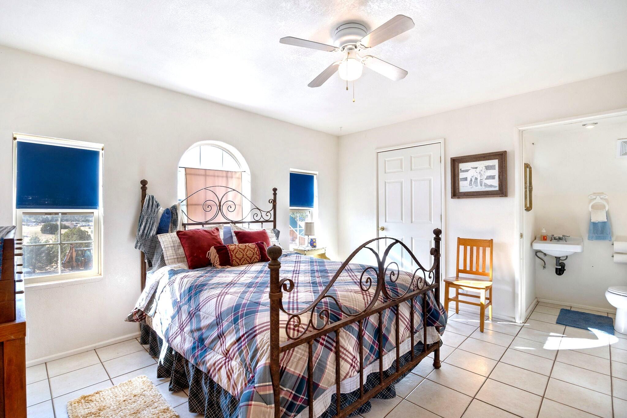 624 Baker Ranch Road Young, AZ 85554 - Photo 44 of 116 a bedroom with a bed and a chandelier