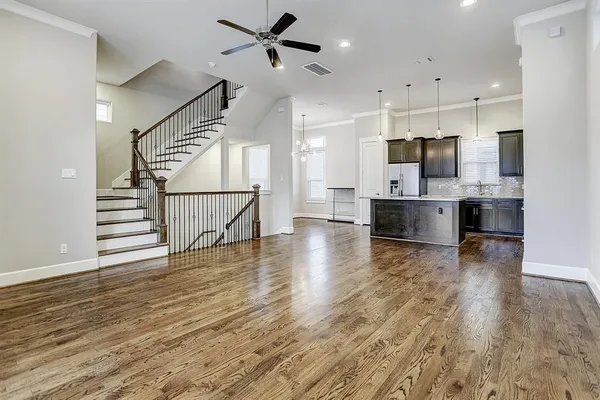 a view of kitchen and hall with wooden floor