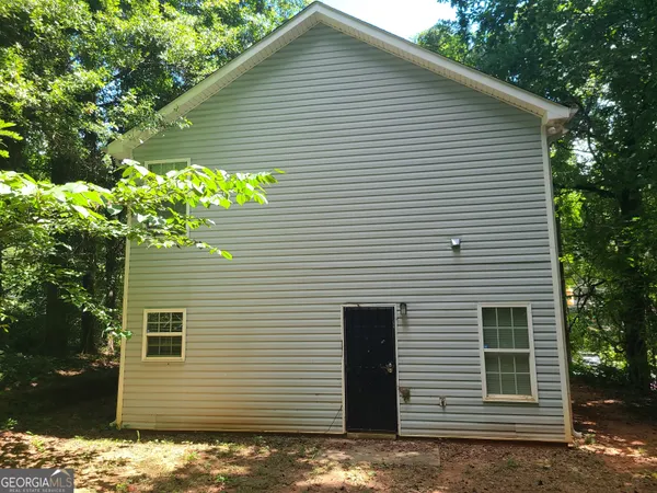 a view of a house with a small yard